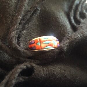 Southwestern spiny orange,turquoise,purple sterling silver ring.
Stamped.